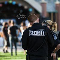two security guards outside at an event