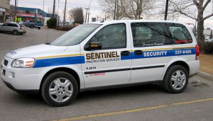 white sentinel security minivan