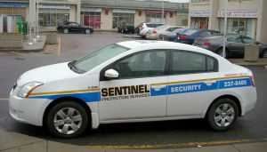white sentinel security car