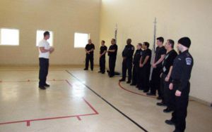 security guard training session instructor talking with group of trainees
