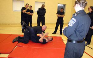 security guard training session grappling on the mat