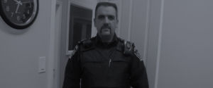 male security guard facing forward - header image