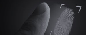 zoomed in photo of finger being scanned for fingerprint - header background image