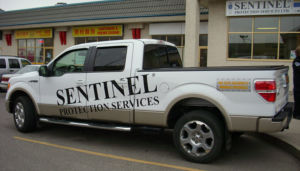 white sentinel protection services truck