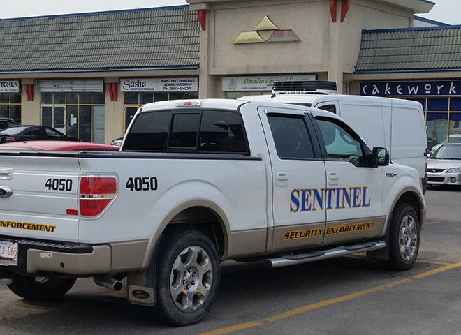 sentinel security white pickup truck