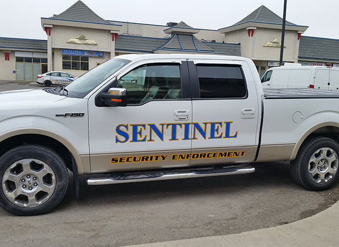 sentinel security white pickup truck
