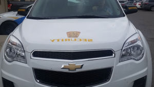 zoomed in shot of front end of sentinel security white SUV
