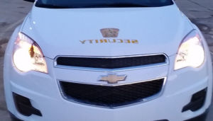 zoomed in front view of white sentinel security suv 5000