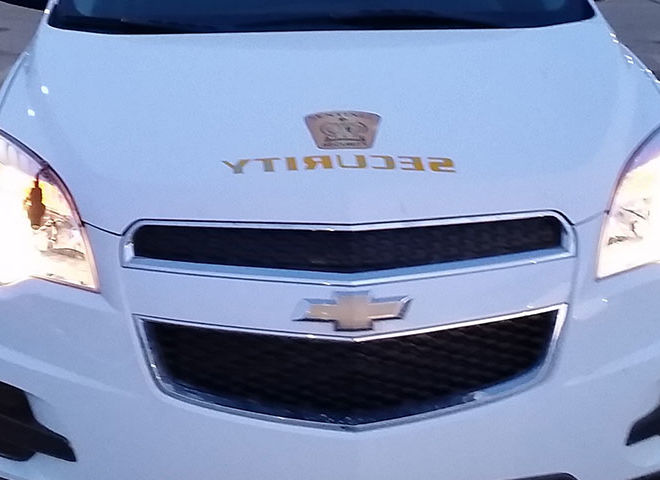 zoomed in front view of white sentinel security suv 5000