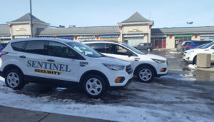 two sentinel security white suvs 5020 and 5010