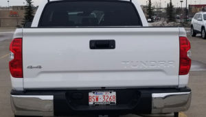 rear view of white 4 door pick up truck