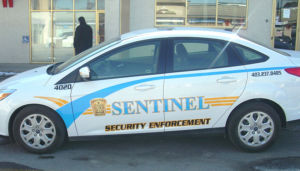 sentinel security white 4 door car number 4020